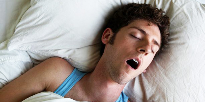 person-sleeping-on-back-having-sleep-apnea